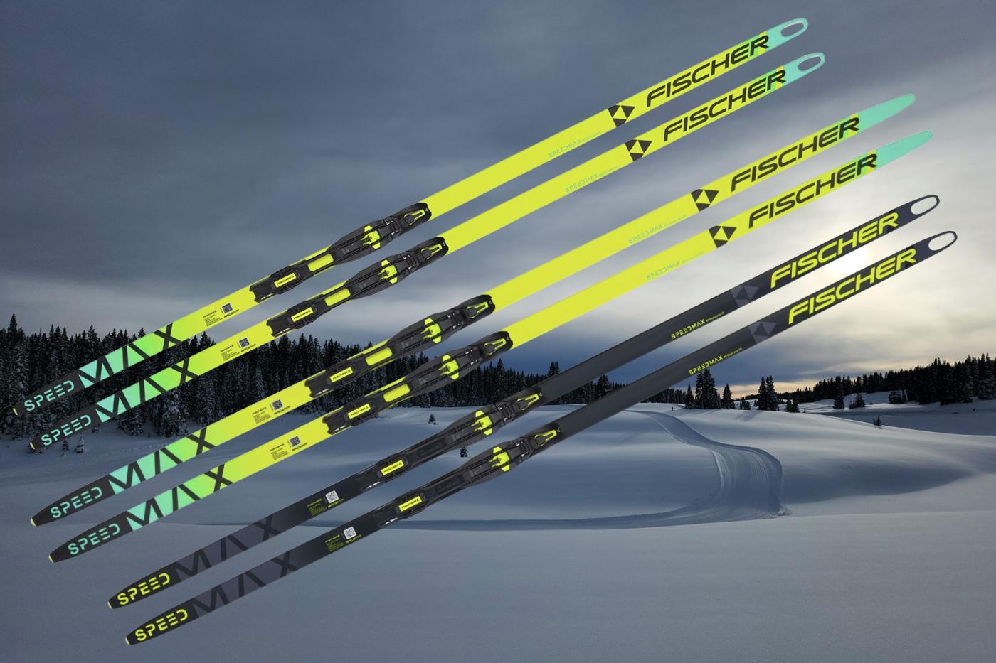 Lineup of Fischer Speedmax skate and classic skis over a winter Nordic trail, illustrating the models compared in this high-country ski guide.